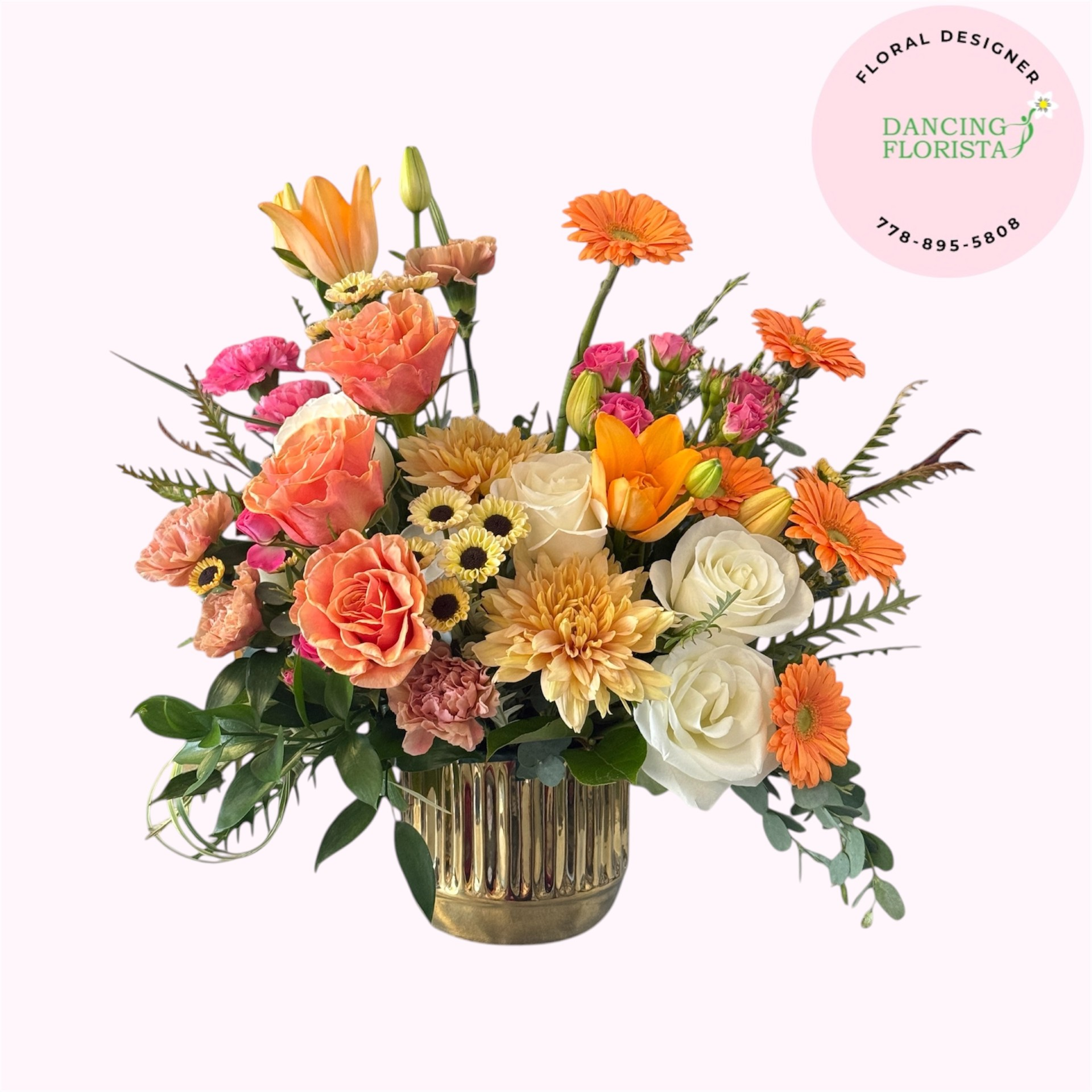 Floral arrangement with roses and seasonal blooms in a modern vase